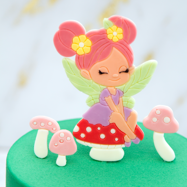 Fairy-themed cake decorated with handmade topper