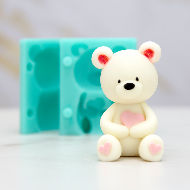 Food-grade silicone mold with 3D teddy bear holding heart design