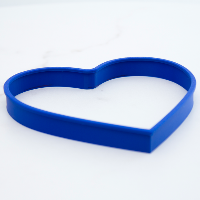 Plastic heart-shaped cake cutter and mold